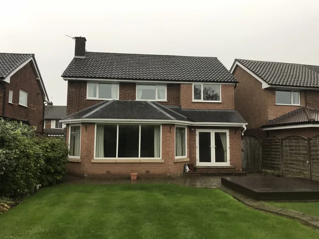 Rear elevation of a detached brick house in Poynton