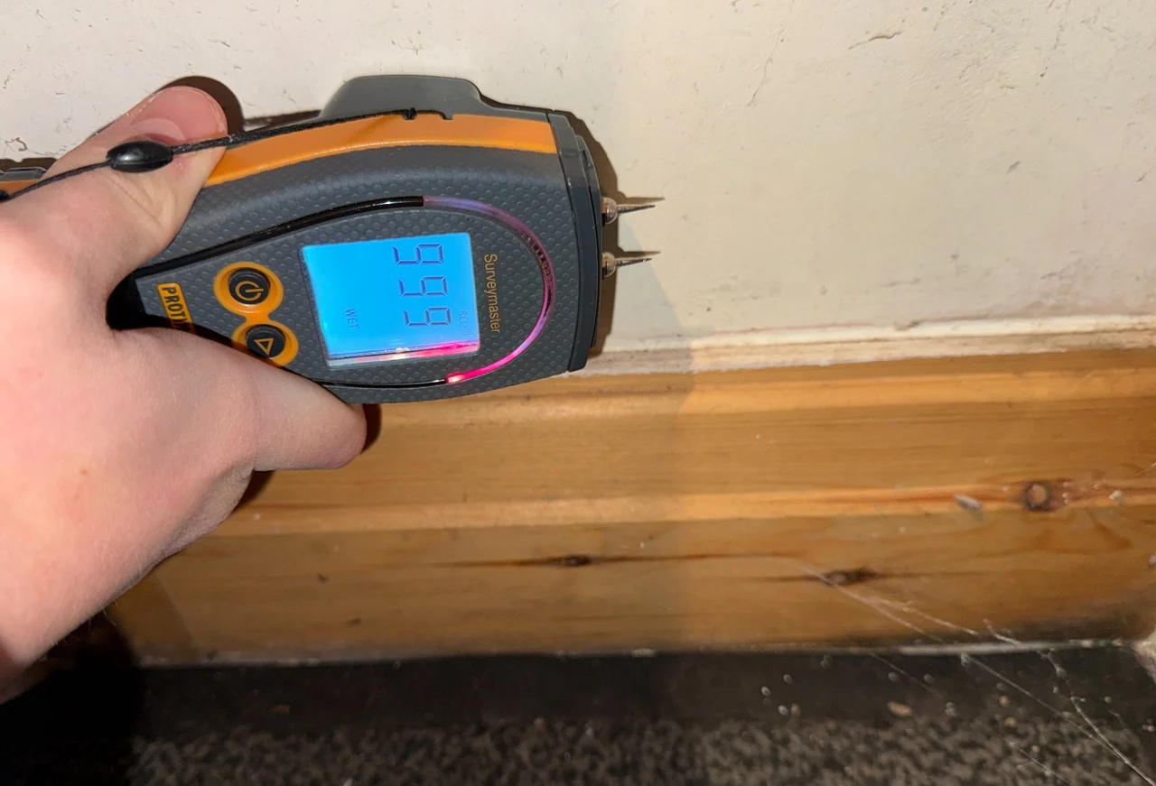 Moisture meter showing a relative response at plaster in Whaley Bridge