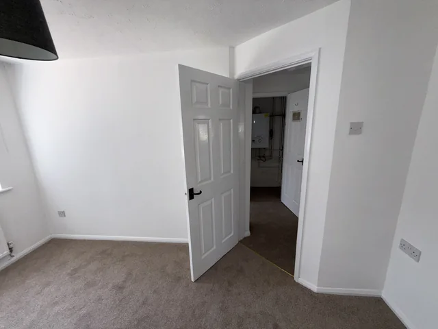 Internal walls, ceiling and doorway in a room with finished flooring
