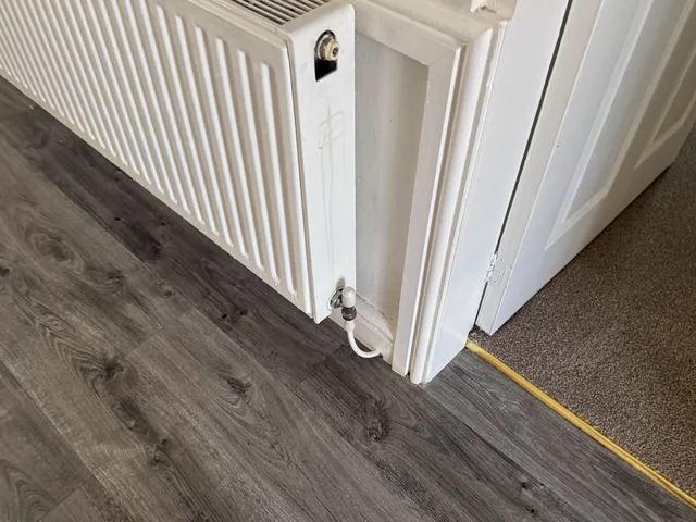 Floor finishes and a threshold adjoining an internal door frame