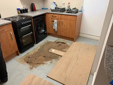 Kitchen floor opened up to expose defective screed and the floor beneath