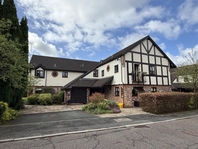 Residential property with contrasting timber detailing and landscaped grounds